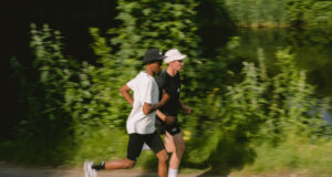 Two men running in black and white