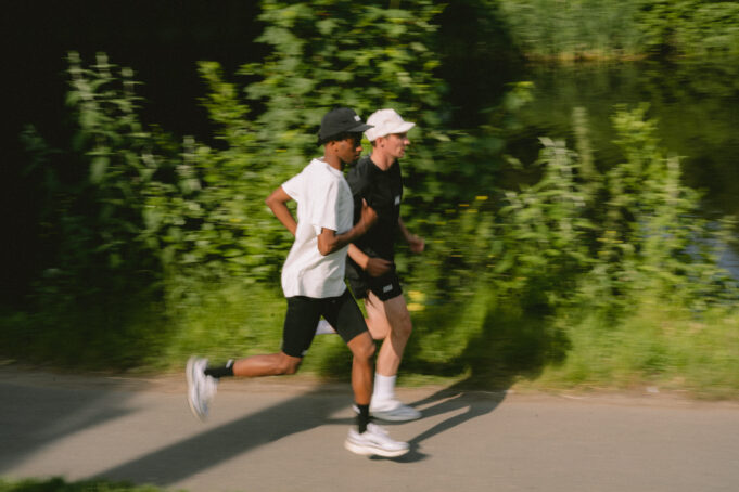Two men running in black and white