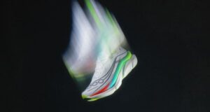 Arty shot of a white running shoe moving so fast it looks like it has Hermes wings