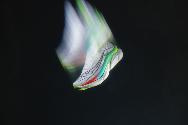 Saucony-Elite-3 Arty shot of a white running shoe moving so fast it looks like it has Hermes wings