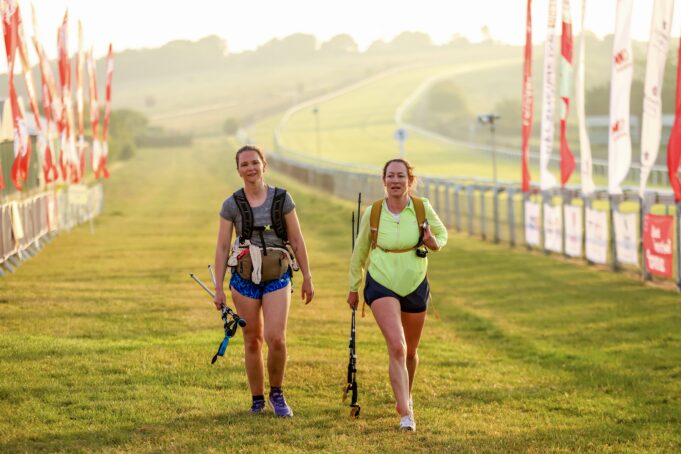 L2B - Walkers Finish Two female walkers on the finish straight. The sun is low in the sky