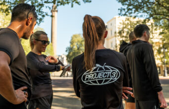 PUMA takes PROJECT3 to Chicago and Berlin A group of people wearing black PUMA tshirts congregate on a street