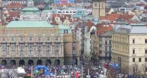 Many runners on a bridge over a river
