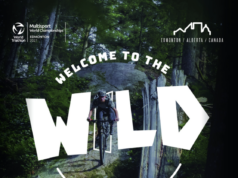 Edmonton to host 2027 Multisport World Champs Person on bike in woods. Text over photo reads Welcome to the wild