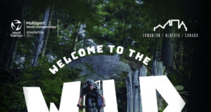 Person on bike in woods. Text over photo reads Welcome to the wild
