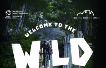 Person on bike in woods. Text over photo reads Welcome to the wild