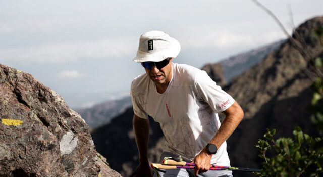 François D’Haene sets FKT on GR20 Man with poles passes through a high mountain gap
