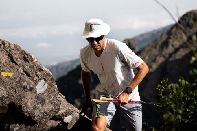 08.13.29 running with poles Man with poles passes through a high mountain gap