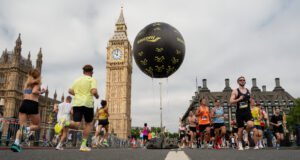 Runners running towards and away from Big Ben/Elizabeth Tower