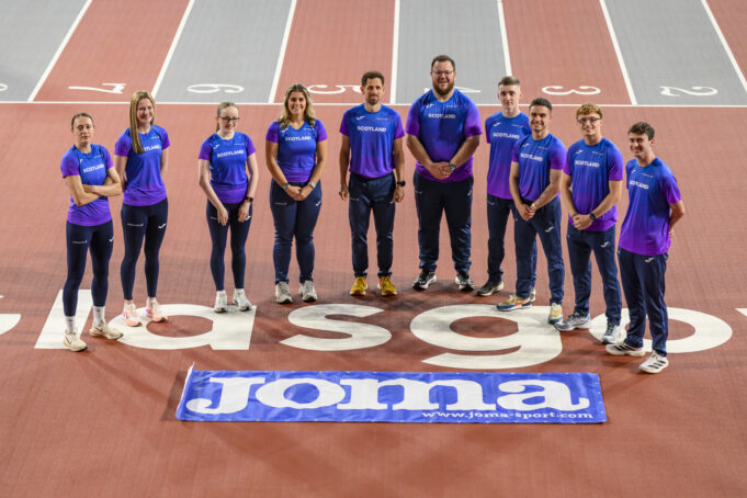 Joma 10 athletes stand on a track in Joma kit