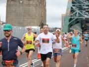 13,000 runners at biggest ever Great North 10K Runners with the Tyne Bridge behind them