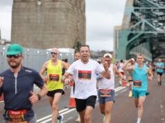 13,000 runners at biggest ever Great North 10K Runners with the Tyne Bridge behind them