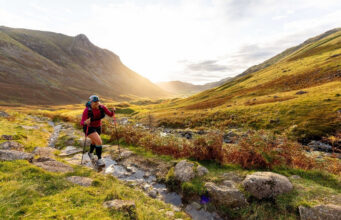 Lone walker in a green valley