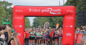 Runners line up on the start line of a road race