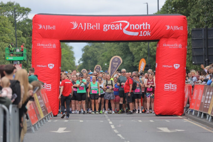 Great North 10k Runners line up on the start line of a road race