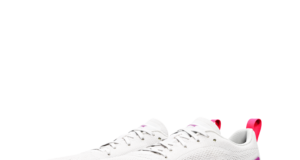 White running shoes with a high drop bright pink sole