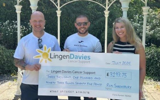 Lingen Davies takes on Shrewsbury Half and Metric Half Two men and a woman hold a giant cheque