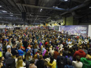 Hodgkinson and McColgan headline National Running Show Hundreds of people sit in front of a large stage listening to a speaker