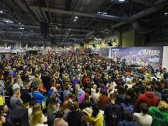 Hodgkinson and McColgan headline National Running Show Hundreds of people sit in front of a large stage listening to a speaker