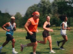 4 people running on grass