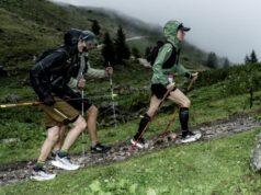 British runners make their mark at KAT100 by UTMB Two people walk up a hill in the rain