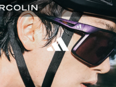 Cloe up shot of man's face wearing cycling glasses and bike helmet