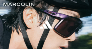 Cloe up shot of man's face wearing cycling glasses and bike helmet
