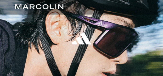 Cloe up shot of man's face wearing cycling glasses and bike helmet