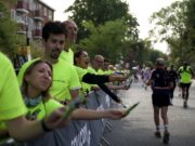 Run Shoreditch Half: Race Recap Supporters in bright yellow neon t-shirts line the streets full of runners