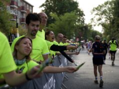 Run Shoreditch Half: Race Recap Supporters in bright yellow neon t-shirts line the streets full of runners