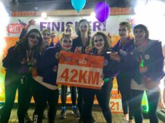Halloween hike through London’s spooky spots A group of runners in Halloween fancy dress hold a sign saying 42km