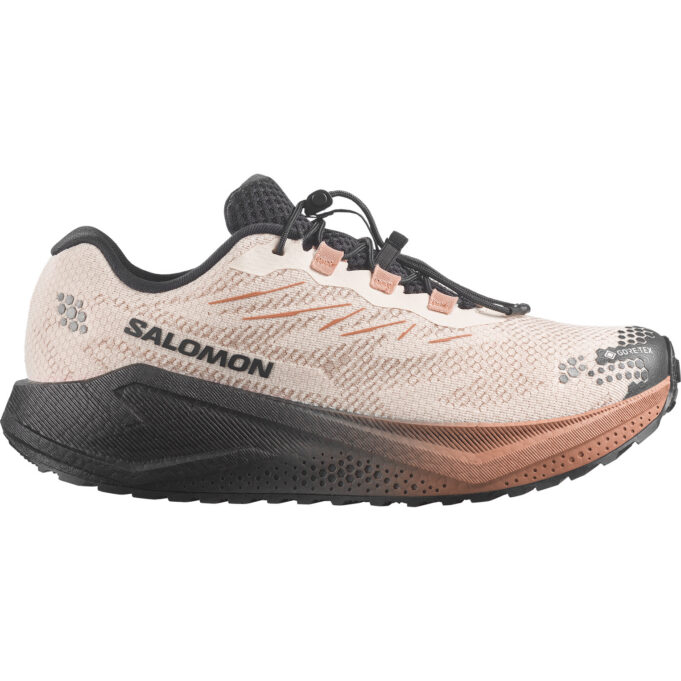 Salomon A photo of a gravel shoe that's cream upper and brown cushioned sole