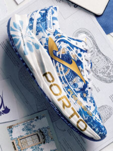 White, blue and gold running shoe