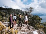 Chica unveils Layers for Autumn 4 women on a rocky outcrop by the sea wearing activewear