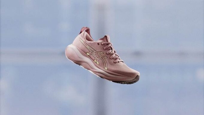 A pink running shoe that looks like it's floating